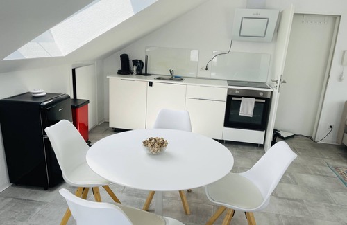 Karthause Condo | Bright, spacious attic apartment.