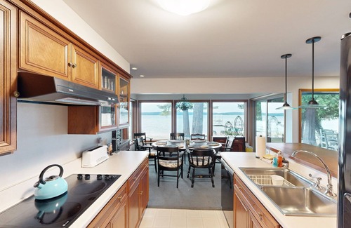 Maple City House | Bright & spacious home on Sandy Tamarack Cove with beach & dock access & firepit