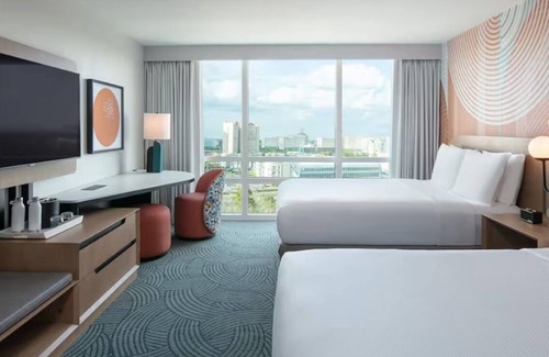 Florida Center Hotel | Bringing the pack? 4 Double Rooms in Orlando near Universal and ICON Park - Pets