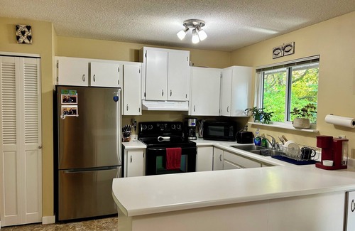 Regional District of Nanaimo House | Budget friendly Qualicum Beach home, with 2 cats & a forest in the back yard