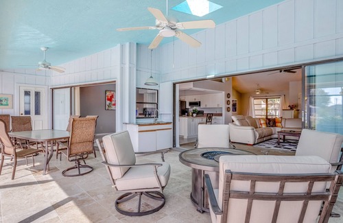 Pebble Beach House | Canal-front home with sandy beaches, golf courses, dock, & refreshing pool