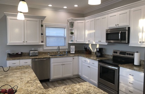 Ocean Isle Beach House | Canal Front w/Putting Green w/private dock & private heated pool; Sleeps 18+