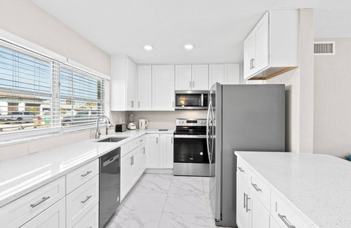 Yacht Club House | Casa Clara - 2 Bedroom, 2 Bath Vacation Home with Electric Heated Pool on Gulf Access Canal