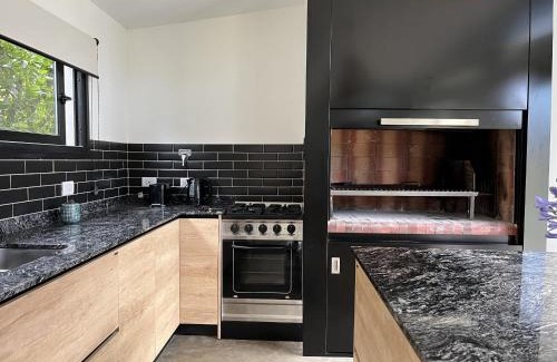 Los Acantilados Apartment | Casa Paola - Loft en Zona Acantilados Para 4 PAX Con Pileta - Hola Sur