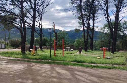 Huerta Grande House | Casas HG-Desayuno sencillo entregado al check in-Pileta climatizada en predio a 2 kilómetros-Acepta mascotas bajo petición-Cochera para 1 auto