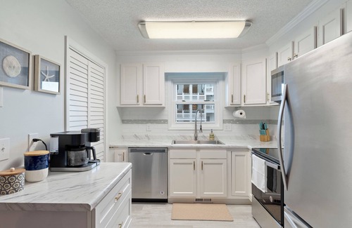 North Carolina Coast Condo | Charming 2-bedroom condo with large covered front porch and partial ocean view!