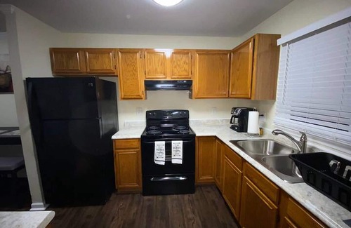 Downtown Greensboro House | Charming 2-bedroom townhome with WiFi, AC in Greensboro Big screen Smart TVs