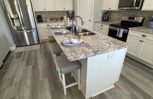 Thomas Drive House | Charming 3-bedroom house with pool, fire pit and grill in Panama City Beach.