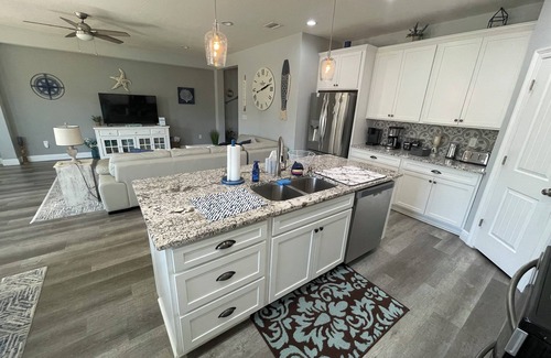 Thomas Drive House | Charming 3-bedroom house with pool, fire pit and grill in Panama City Beach.