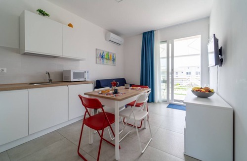 Pachino Apartment | Charming 40 sqm apartment with sea view, accommodating up to 4 guests, located within the renowned Borgo 84 residence, which features a swimming pool and a cycling path. The property is just 3 km from the center of Marzamemi, one of the most picturesque