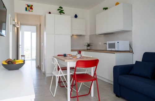 Pachino Apartment | Charming 40 sqm apartment with sea view, accommodating up to 4 guests, located within the renowned Borgo 84 residence, which features a swimming pool and a cycling path. The property is just 3 km from the center of Marzamemi, one of the most picturesque