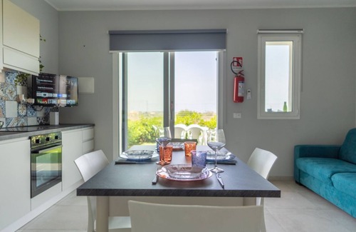 Pachino Apartment | Charming 75 sqm seaview apartment on two levels, for 5 people, located inside the renowned Borgo 84 residence, equipped with swimming pool and cycle path. The property is located just 3 km from the center of Marzamemi, one of the most fascinating seaside