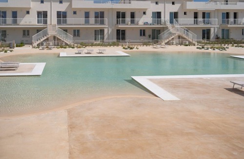 Pachino Apartment | Charming 75 sqm seaview apartment on two levels, for 5 people, located inside the renowned Borgo 84 residence, equipped with swimming pool and cycle path. The property is located just 3 km from the center of Marzamemi, one of the most fascinating seaside