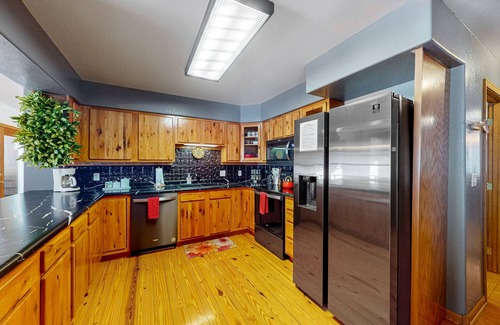 Lead House | Charming home with mountain view, private hot tub, deck, & two kitchens