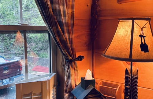 Green Mountain Cabin | Charming riverfront 2-bedroom cabin with hot tub, WiFi, AC in Green Mountain Nc