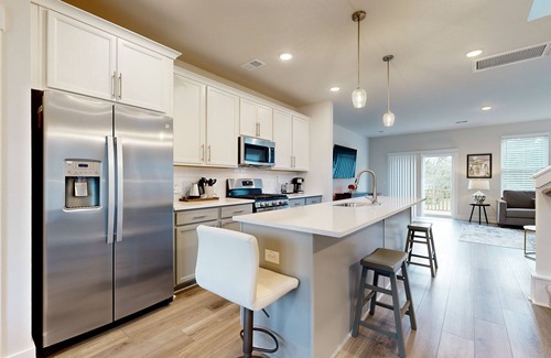 Goose Creek House | Charming townhouse with deck and washer/dryer, central AC, and WIFI