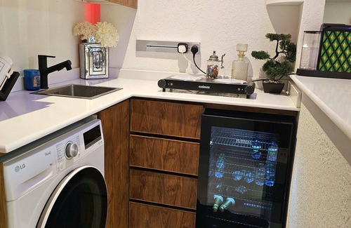 Riyadh Apartment | Chic 1-bedroom living room kitchen small garden. with WiFi, AC in Riyadh