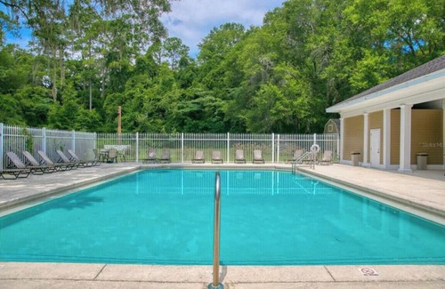 Haile Plantation Condo | Chic Haile Village 2bed/2bath Condo Overlooking Nature -Access to Pool & Gym