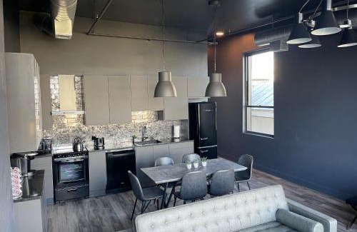 West Main Historic District Apartment | City Loft Escape with River Views! By Hollyhock