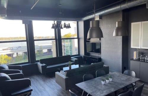 West Main Historic District Apartment | City Loft Escape with River Views! By Hollyhock