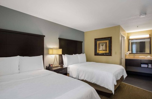 Florida Central Atlantic Coast Hotel | Close to SeaWorld Orlando! TWO 2BR Suites with Kitchens, Pool, Pets Allowed!