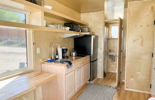 Buena Vista House | Columbia is a one-level Tiny Home with full bathroom, fridge, induction cooktop, microwave, AC/heat, and beautiful mountain views!
