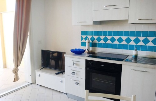 Paduledda Apartment | Comfortable one-bedroom apartment with wide sea view, shared pool and parking space
