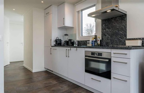 Burgh-Haamstede House | Comfortable 4-person chalet with living room with sofa and 2 lovely armchairs, air conditioning, 2 b