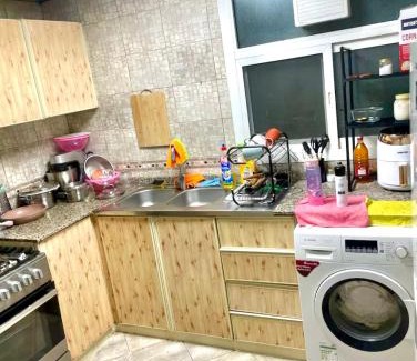 Al Nahda Apartment | Comfortable Apartment Bedroom And Spacious Living Room Family and Couple