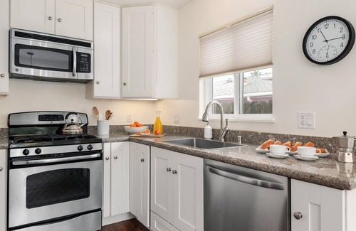 East Beach House | Comfortable Condo Just a Half Block to East Beach!