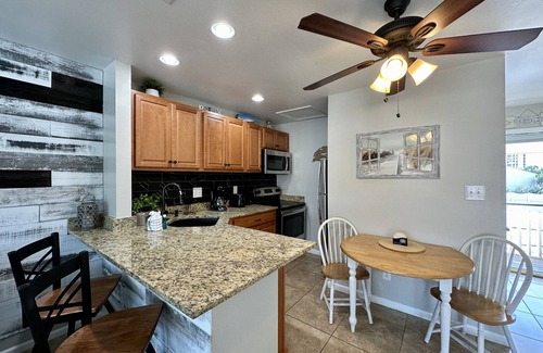 Holiday Isle Condo | Condo #8215 – Overlooks the Sparkling Pool and Features Granite Countertops!