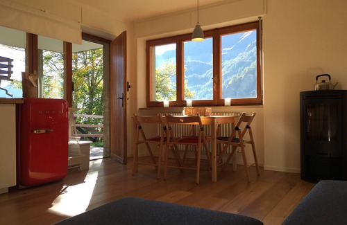Paquier Apartment | Contemporary apartment with wood burning stove and private terrace with mountain views