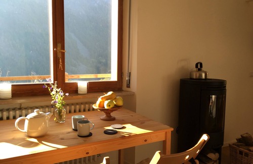 Paquier Apartment | Contemporary apartment with wood burning stove and private terrace with mountain views