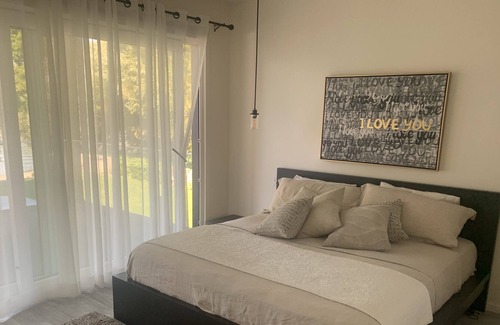 Vernon House | Contemporary Beachfront Home with Hot Tub and Sand Beach