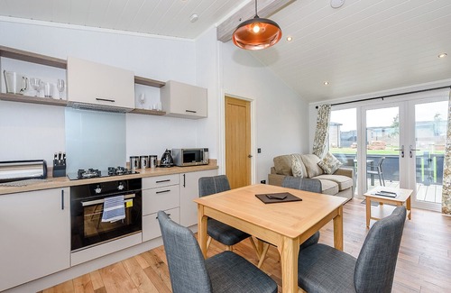 Penrith Ski Chalet | Contemporary semi-detached lodge with master double with Smart TV and en suite with walk in shower.
