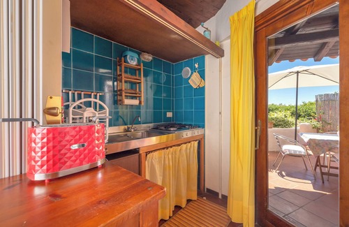 Baia Caddinas House | Cottage with Terrace and Sea View; Parking Available on Street
