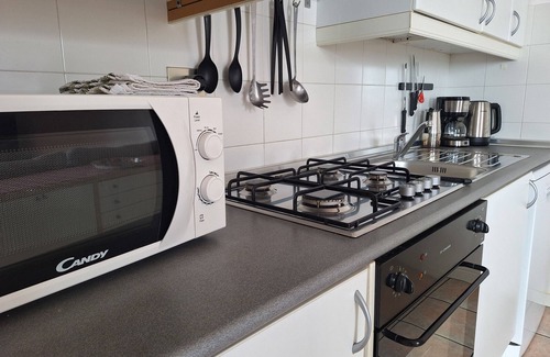 Sala Comacina Apartment | Cozy apartment with swimming pool, just a short walk from the lakeside.