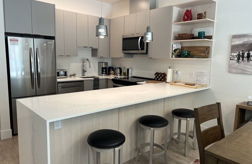 Revelstoke Condo | Cozy & bright mountain getaway. Enjoy a soak after a hard day's play!