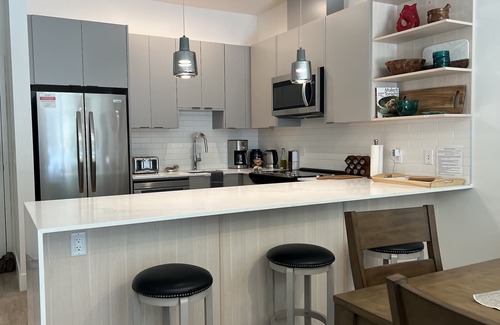 Revelstoke Condo | Cozy & bright mountain getaway. Enjoy a soak after a hard day's play!