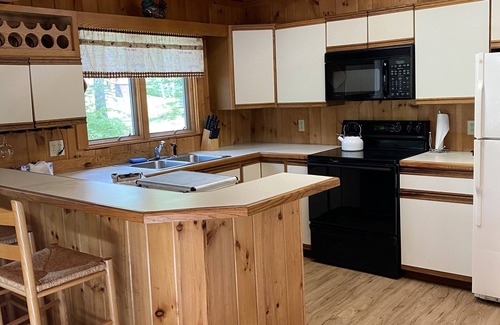 Chocorua Ski and Beach House | Cozy cabin with hot tub in a peaceful setting!