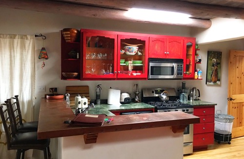 Taos Condo | Cozy Casa Carmelita features a Brilliant Kiva Fireplace, Unique Patio & Hot Tub!