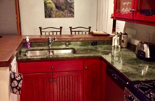 Taos Condo | Cozy Casa Carmelita features a Brilliant Kiva Fireplace, Unique Patio & Hot Tub!