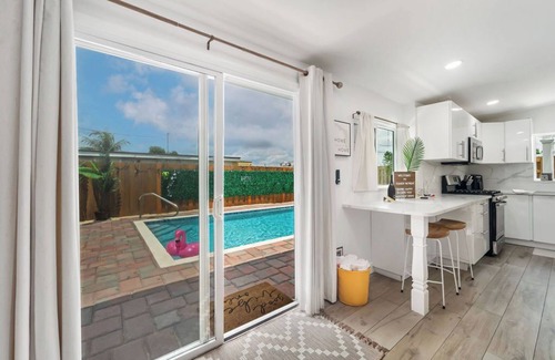 Lake Worth House | Cozy, clean home with heated saltwater pool, game room, bikes, lake community!