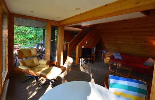 Suttons Bay Cabin | Cozy cottage high in the trees. Walk to the beach. Small dog considered.