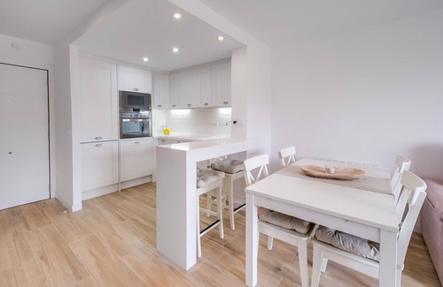 Palafolls Apartment | Cozy duplex for 4 people, free wifi and air conditioning next to the bedrooms. Vivalidays Elisabet community pool and garden