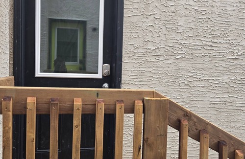 Winnipeg House | Cozy private bsmt suite |Bonavista |Fireplace, workspace & nature-inspired decor