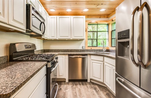 Lexington House | Cozy Red Cottage Located Directly Next Door From The Log Cabin