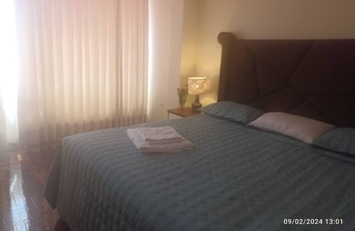 Puno House | Cozy room with TV and private bathroom