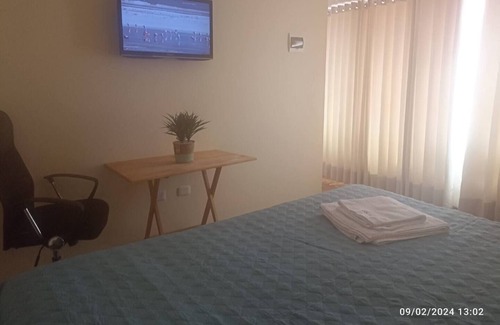 Puno House | Cozy room with TV and private bathroom