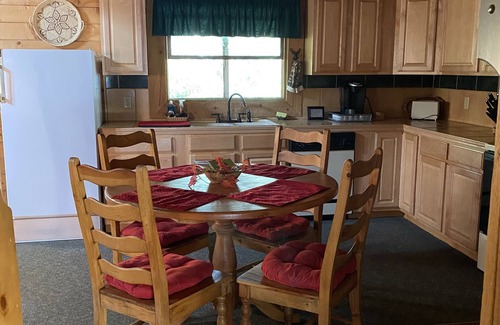 Whispering Pines Cabin | Cozy streamfront cabin nestled in the pines
